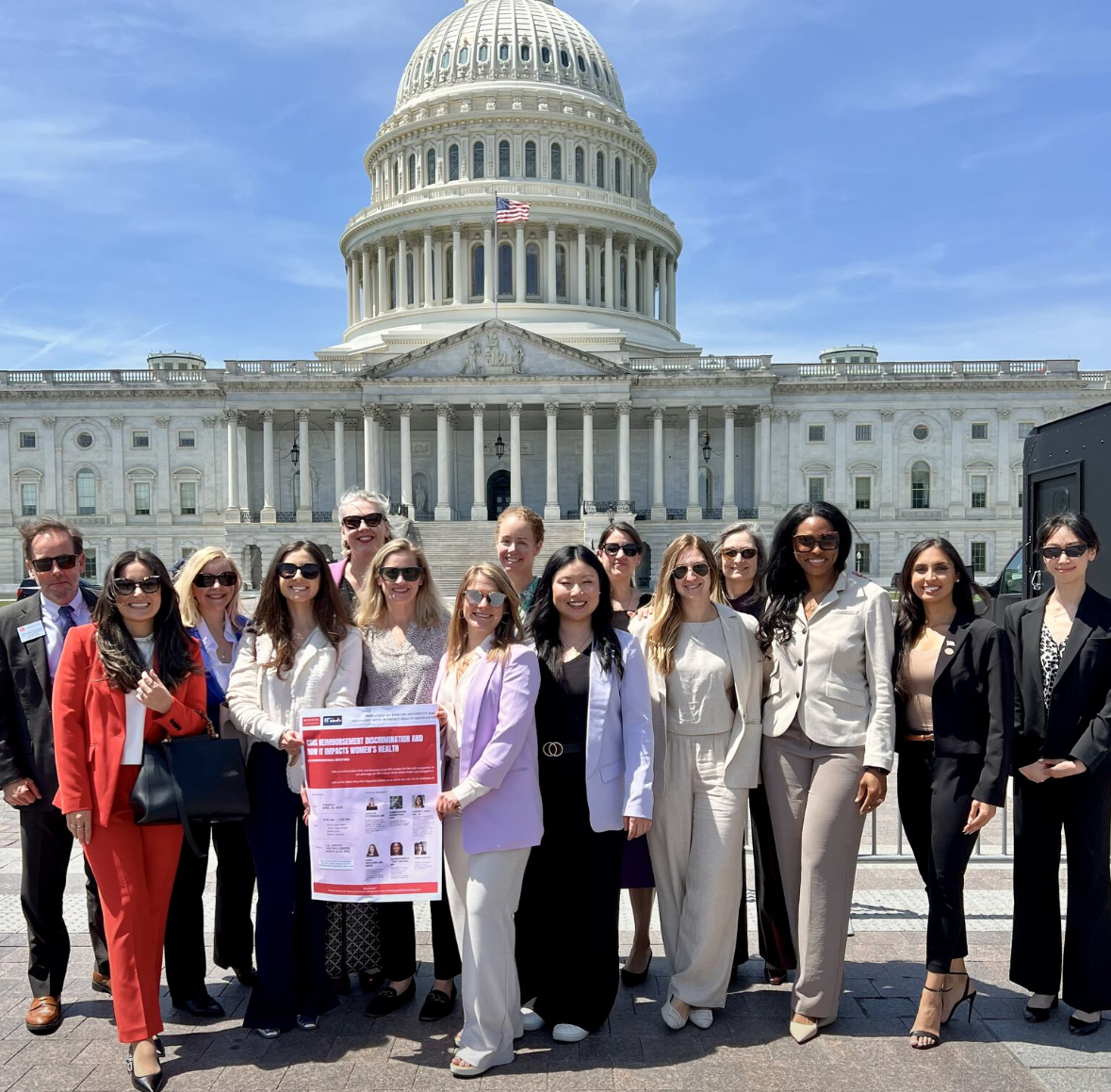 EEFA advocates gather at the U.S. Capitol for the CMS Reimbursement Congressional Briefing, holding a sign about reimbursement discrimination and women’s health.